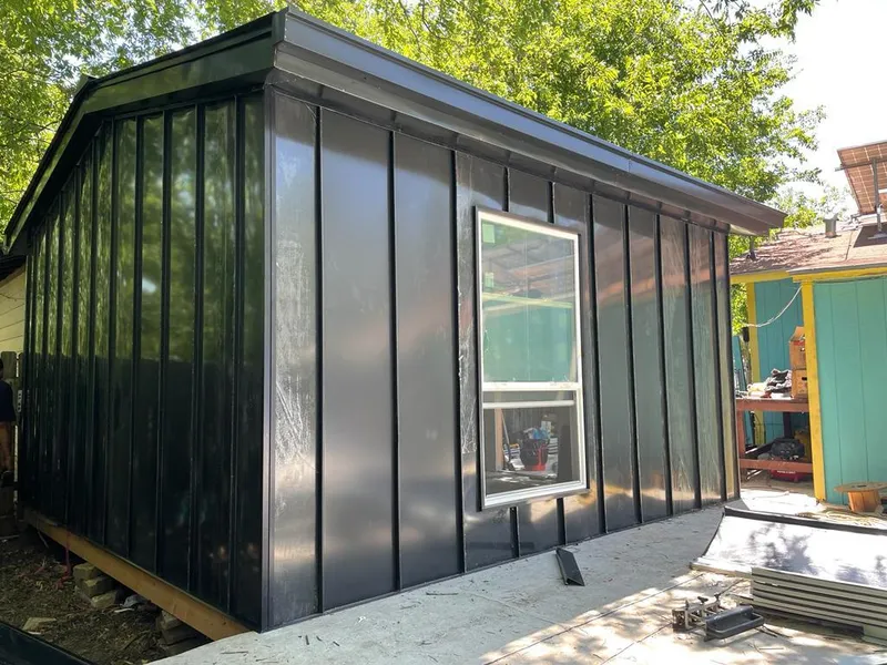 Black standing seam metal wall panels for Roof Inspection in DeRidder